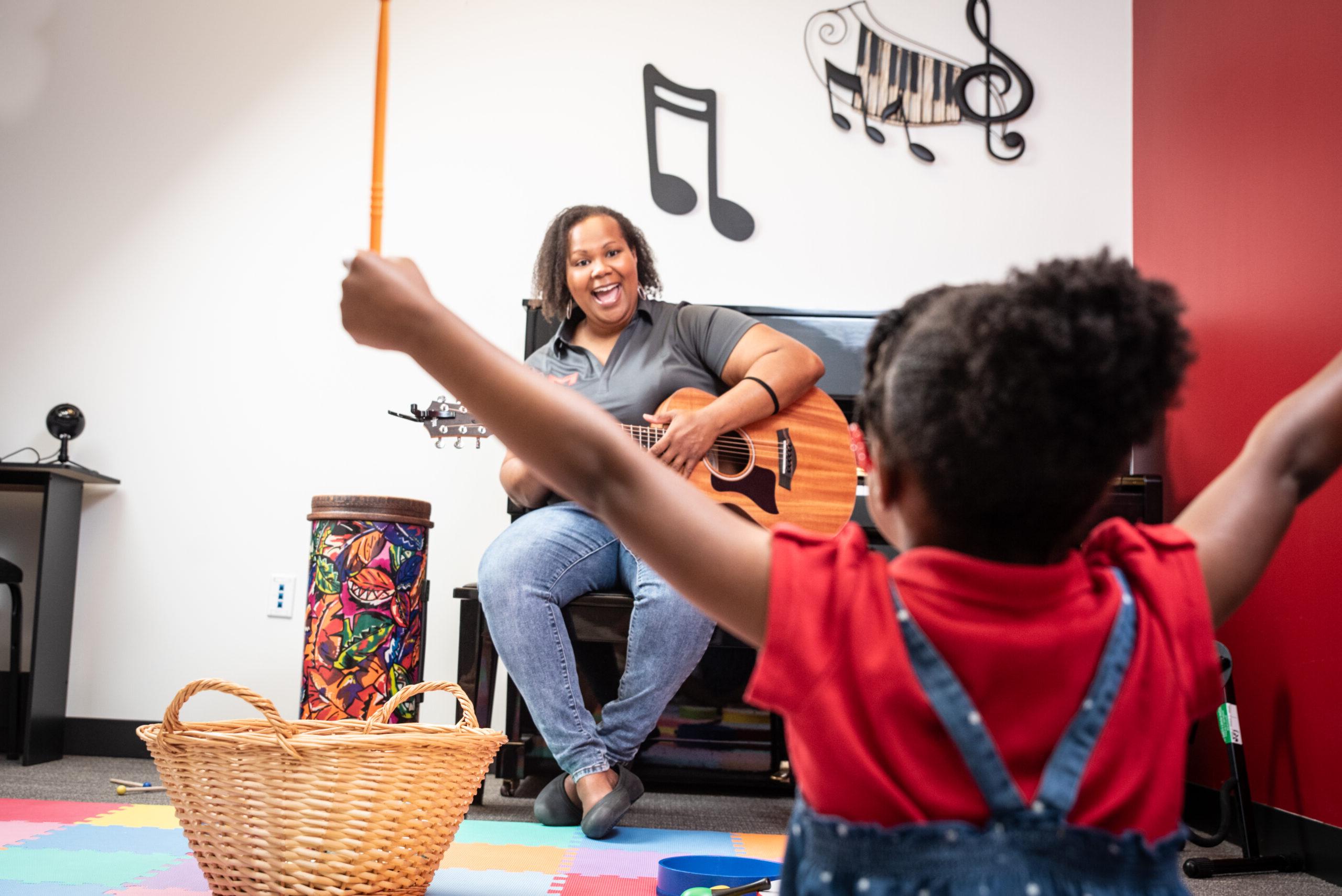 Maryville University music therapy student working with a patient